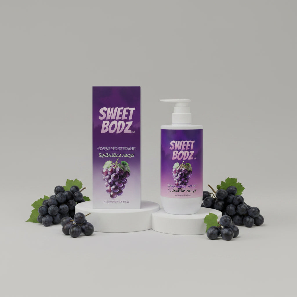 SWEETBODZ Grape Body Wash 500ml displayed on white studio pedestals with fresh grapes and matching product packaging
